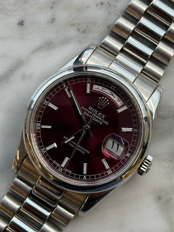 Rolex - Pre-owned Platinum Day-Date Presidential Cherry Dial Arabic Day and Date Wheel 118206