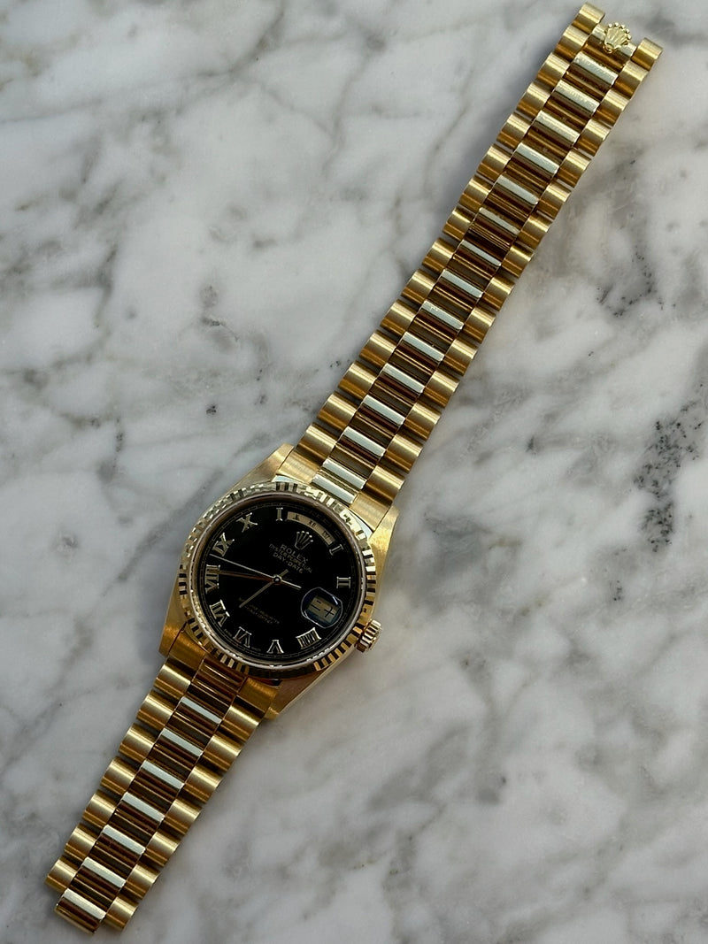 Rolex - Pre-owned Yellow Gold Day-Date 36mm Asian Day & Date-Wheel Black Pyramid Roman Dial 18238