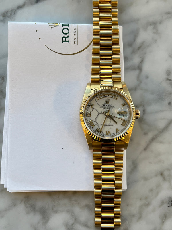 Rolex - Pre-owned Yellow Gold Day-Date Double Quick Set 36mm Arabic Day & Date-Wheel White Howlite Stone Dial 18238